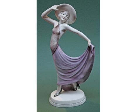 An Art Deco Katzhutte figure of a girl wearing a hat and long dress, height 43cm. Condition - very good, no chips, cracks nor