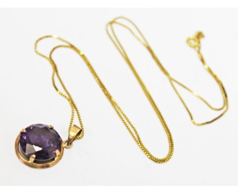 A yellow metal amethyst pendant on yellow metal chain, each with foreign marks, gross wt. 7.3g.