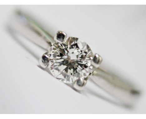 An 18ct white gold diamond solitaire ring, the diamond approx. 0.50 carats, gross wt. 3g, size M/N.