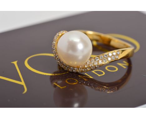 A MODERN YOKO GOLD CULTURED PEARL AND DIAMOND DRESS RING, centring on an Akoya cultured pearl measuring approximately 9.2mm i