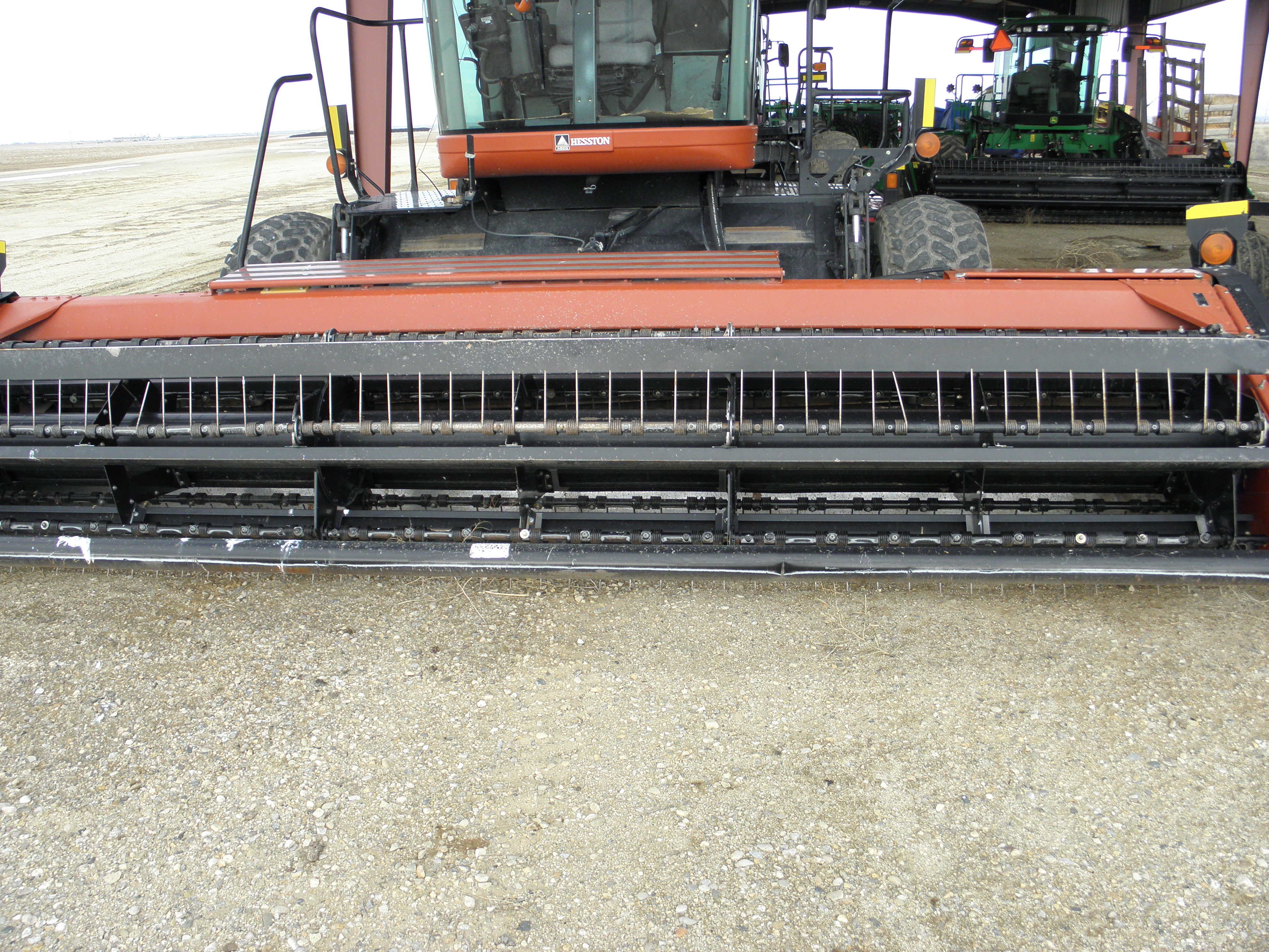 Lot 4 Hesston 8450 swather 16 foot header with conditoner clean one owner Lot 4 Hesston 8450 swather 16 foot header with conditoner clean one owner