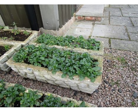Pair of stone trough planters with feet