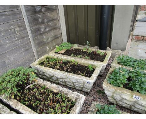 Pair of stone trough planters with feet