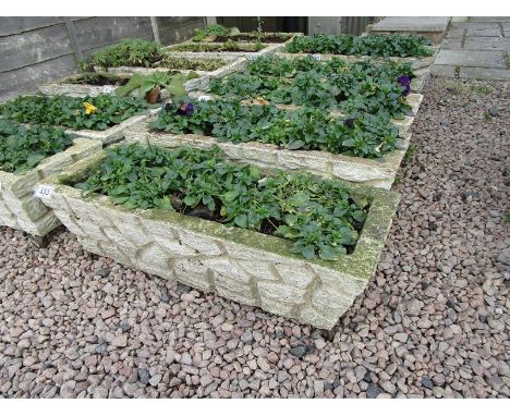 Pair of stone trough planters with feet
