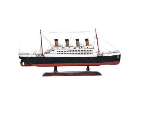 A DISPLAY MODEL OF THE WHITE STAR PASSENGER LINER ' R.M.S TITANIC' In glazed display case  62cm long, 9cm wide, 29cm high ove