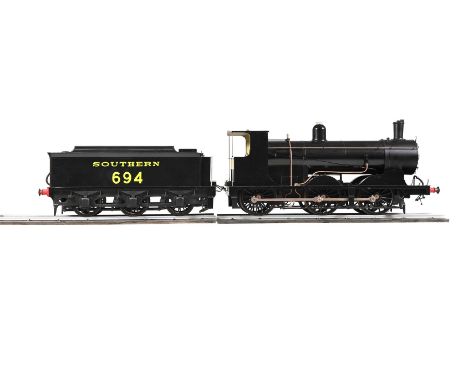 A WELL-ENGINEERED 7 1/4 INCH GAUGE MODEL OF A SOUTHERN RAILWAY 0-6-0 TENDER LOCOMOTIVE NO 694  BUILT BY THE LATE MR ENNIS OF 