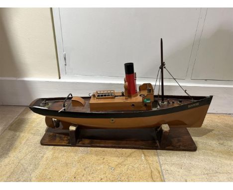 A MODEL OF A LIVE STEAM POWERED TUGBOAT 'BENMORE'  EARLY 20TH CENTURY With fitted mast, rigging, funnel, vents, oscillating e