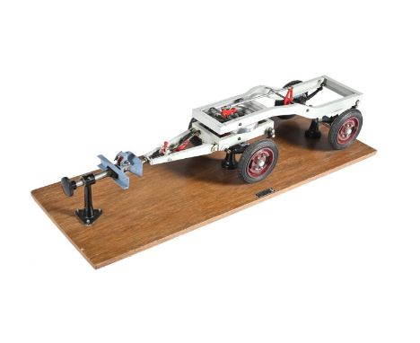 AN EXHIBITION MODEL OF A COMMERCIAL LORRY CHASSIS With detailed suspension and four-wheels with rubber tyres and articulated 