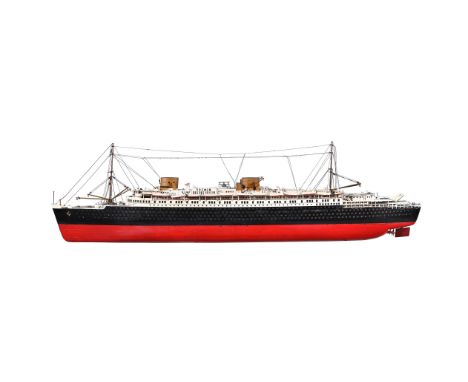 A WOODEN CONSTRUCTED TRAVEL DISPLAY MODEL OF THE SS BREMEN CIRCA 1930 Having masks with rigging, wheel house, multiple life b