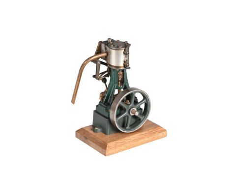 A MODEL OF A STUART TURNER 10V VERTICAL STEAM ENGINE Having metal clad cylinder with drain cocks, trunk guide, open crank wit