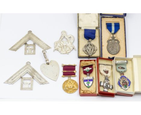 A collection of Masonic medallions to include a silver Hall stone medal and ribbon, in Mappin & Webb case, together with silv