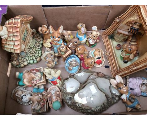 A collection of 1970s Pendelfin rabbit figures and stands/displays.