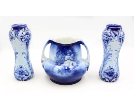 A pair of Macintyre Florian Ware ceramic vases, Poppy pattern, both signed W. Moorcroft, each approximately 16.5cm high. Alon