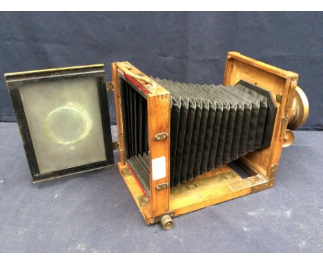 A late 19th century Ernemann of Dresden mahogany and brass plate camera, with makers plaque