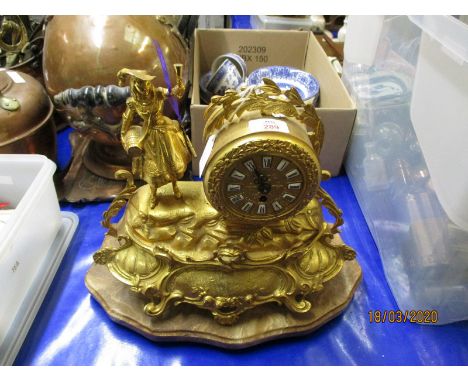 FRENCH GILT SPELTER MANTEL CLOCK WITH ENAMELLED ARABIC CHAPTER RING ON AN ONYX BASE
