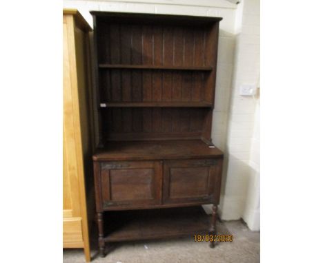 EARLY 20TH CENTURY OAK FRAMED DRESSER WITH TWO FIXED SHELVES AND PANEL BACK WITH TWO CUPBOARD DOORS WITH OPEN SHELF