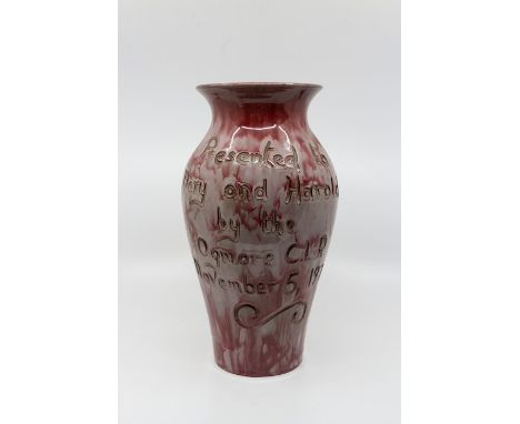 E Wenny studio pottery vase of baluster form, red and cream glaze, incised 'Presented to M and H Wilson by the Ogmore C.I.P.,