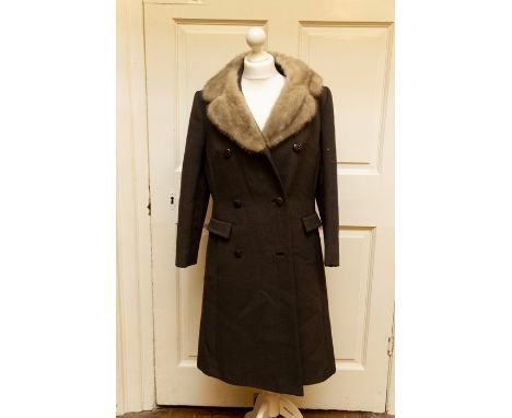 Ladies grey coat with light grey fur collar by “Seigal”.&nbsp;Harold &amp; Mary Wilson collection

