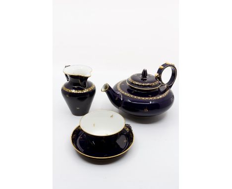 A Sevres porcelain 10-piece tea set including ten cups, ten saucers, tea pot, sugar bowl, milk jug, navy blue ground decorate