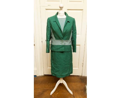 1970s ladies dress with short matching jacket with two button front in green and light blue by “Digby Morton”. Size 12 approx