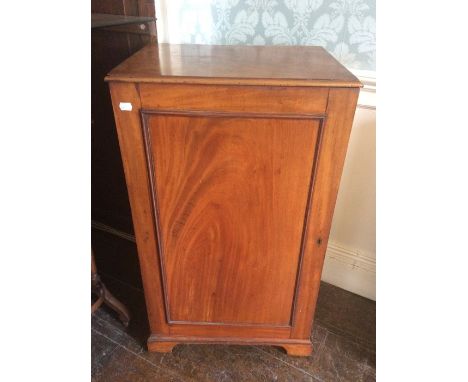 A Victorian mahogany single door side cabinet, the door enclosing two fitted shelves, with carrying handles to sides, raised 