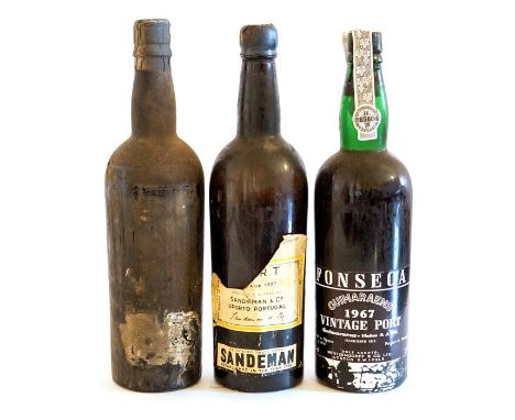 A bottle of Fonseca 1967 vintage port, together with a bottle of Sandeman vintage 1927 port, and a bottle of port with no lab