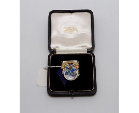 An silver-gilt and enamel presentation shield-shaped badge, the silver-gilt banner engraved with `Borough of Jarrow' above pa