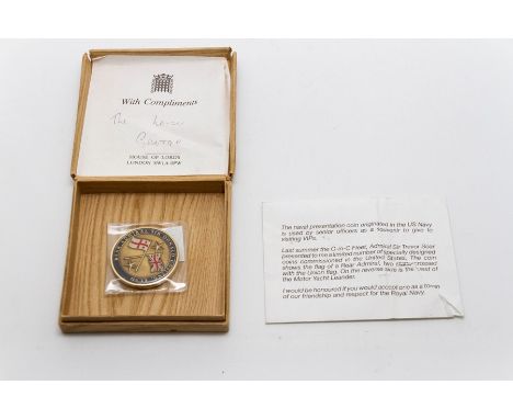 An American Naval presentation coin with typewritten explanation on envelope reading:
The naval presentation coin originated 