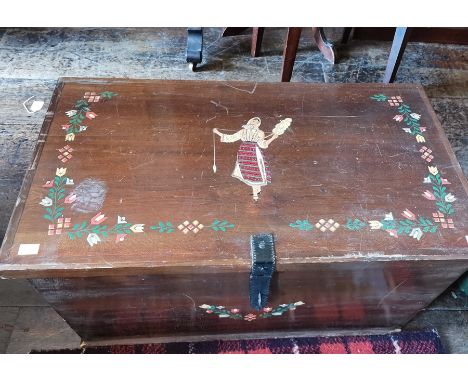 A 20th Century travelling trunk, the lid and front with hand painted decoration, carrying handles to sides, 39cm high, 74cm w