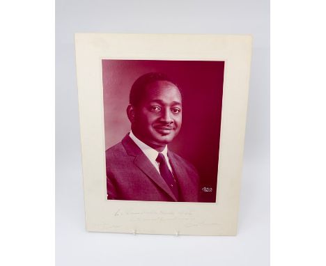 Forbes Burnham, the first Prime Minister and second President of Guyana, photographic portrait inscribed to mount, 'To Prime 