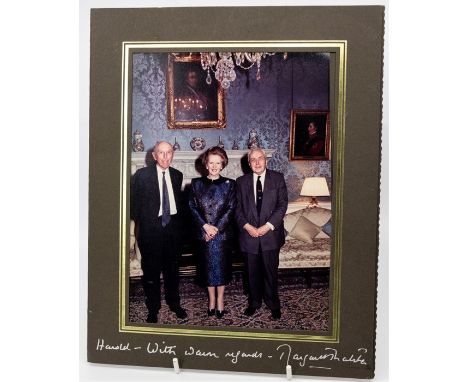 Photographic portrait of Margaret Thatcher and Harold Wilson, inscribed and signed by Thatcher in bold silver ink to the moun