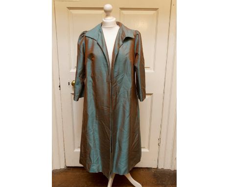 A collection of 1970s designer ladies dresses by “Bill Pashley” with blue/orange/brown/purple printed design. Together with a