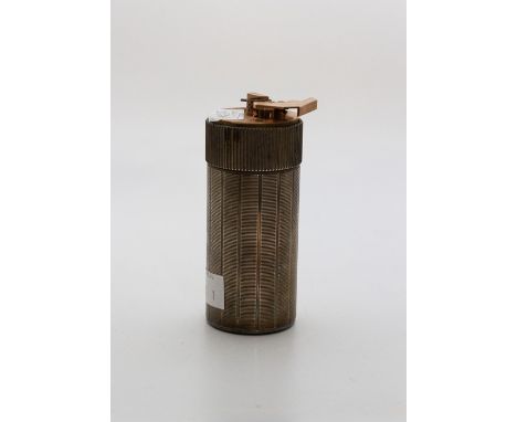A French silver plated engine turned gas cylindrical table lighter, the base stamped S T Dupont&nbsp;de Paris and 1963 Z&nbsp