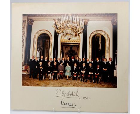 Photographic group portrait of HM Queen Elizabeth and HRH Prince Charles with various political dignitaries, including Harold