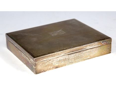 An Elizabeth II plain square shaped cigar/cigarette box, the engine turned cover with rectangular cartouche engraved with ini