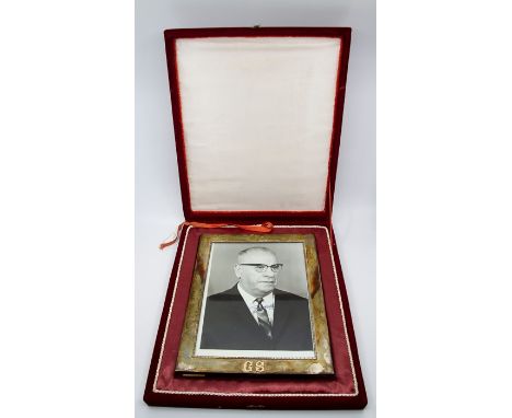 Photographic portrait of a European politician, indistinctly signed in blue ink, presented in silver frame bearing initials, 