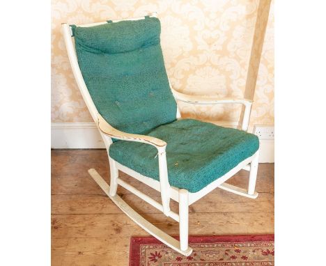 A mid 20th Century white painted rocking chair, having removable green seat and back cushions, ladder backs, shaped arm suppo