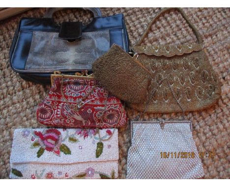 Five mid 20th century evening bags to include four bead examples and one red hand stitched example, together with a vintage b
