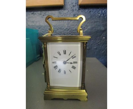 A 20th century French brass five window carriage clock, with key 