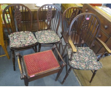 A set of four elm seated stick back dining chairs, together with a mahogany piano stool 