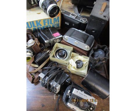 Vintage cameras to include a Nikkormat and an Agfa Isolette with camera accessories and mixed lenses 