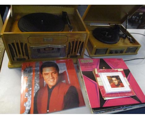 Eight Elvis LPs together with a CD, a 2020 calendar, Classic Collectors edition record/CD player and a small record player 