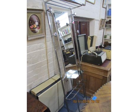 An Art Deco chrome plated tubular hall stand with a mirrored back shelf and hooks and a stick stand base 