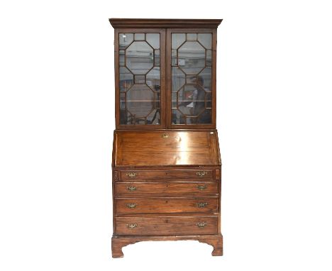 A George III Mahogany Bureau Bookcase, with astragal glazed top section, and on bracket supports, 94cm by 54cm by 206cm