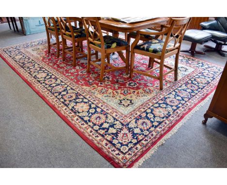 Isfahan Nejafabad Carpet, the raspberry field of meandering vines and palmettes centred by a flowerhead medallion enclosed by