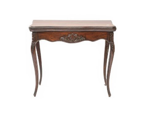 A Victorian Carved Mahogany Foldover Card Table, serpentine fronted, 82cm by 41cm by 72cm