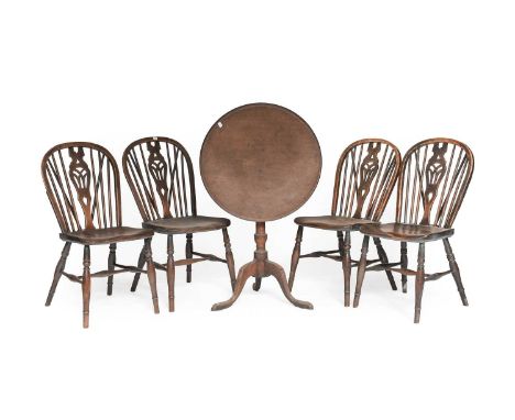 A George III Mahogany Dish Topped Tripod Table, together with a set of four elm stick back Windsor chairs (5)Seats 43cm high,