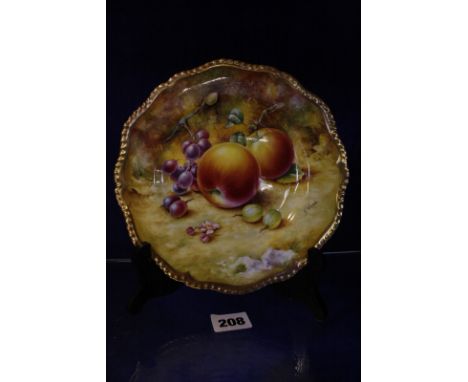 A Royal Worcester cabinet plate, gilt rim with hand painted fruit, signed S.Wood, 20cm