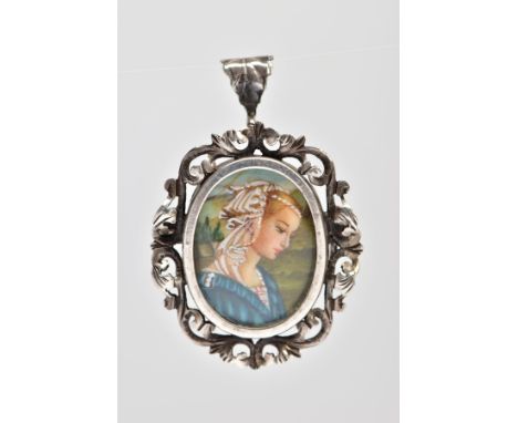 A PENDANT/BROOCH, of oval outline with central hand painted portrait of a lady within a scrolling acanthus leaf surround with