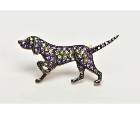 A GEM SET DOG BROOCH, designed as a pointer dog, set with circular peridots and amethysts to the body, and brilliant cut diam